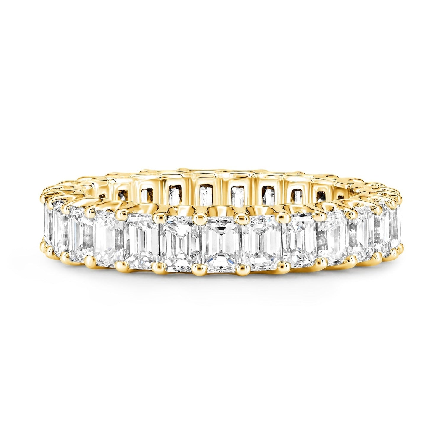 A yellow gold eternity ring featuring a continuous row of emerald-cut clear diamonds on a plain white background.