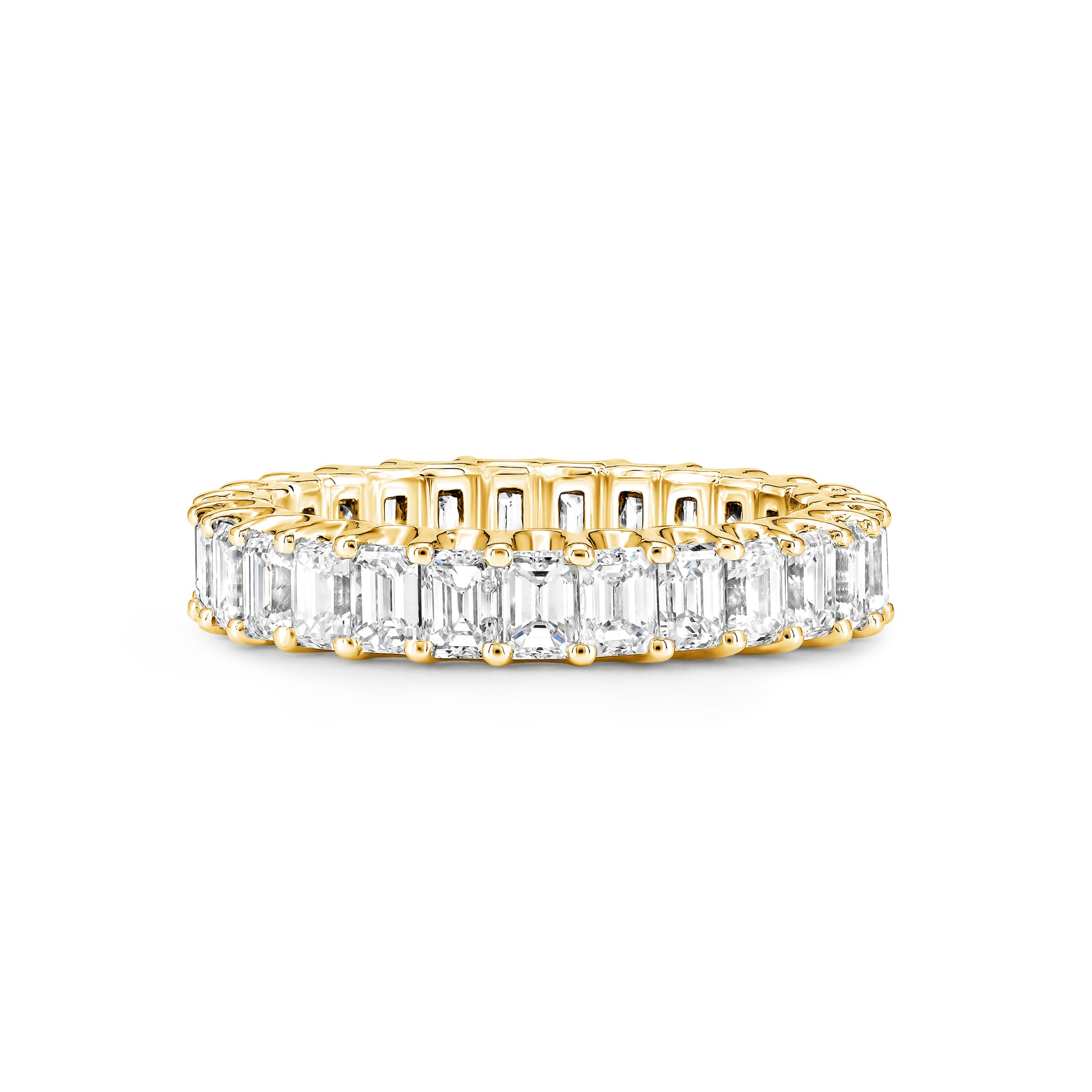A yellow gold eternity ring featuring a continuous row of emerald-cut clear diamonds on a plain white background.